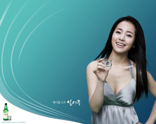 Woman holding glass water bottle - dark background free wallpaper