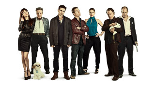 Group people dog man holding - a dog in front free wallpaper