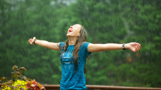 Woman standing rain arms outstretched - the rain free wallpaper