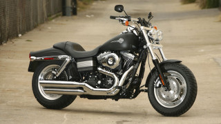 Black motorcycle sidewalk fence building - dan scott free wallpaper