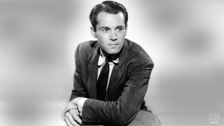 Man suit leaning table crossed - charles mahoney free wallpaper