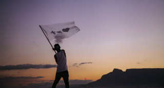 Man holding flag beach sunset - breyten breytenbach free wallpaper