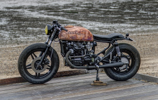 Motorcycle parked wooden platform water - cafer bater free wallpaper