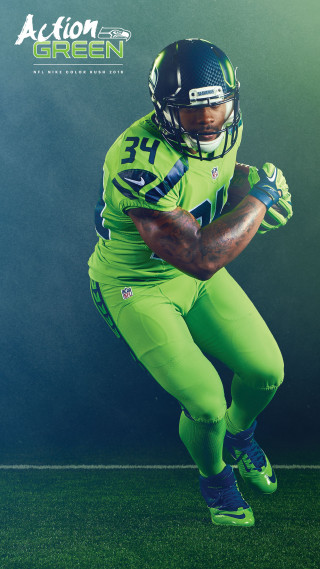 Football player green uniform pose - free sports wallpaper for mobile