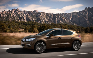 Brown car driving road mountains - a brown car free wallpaper