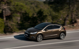 Brown car driving forest road - a brown car free wallpaper