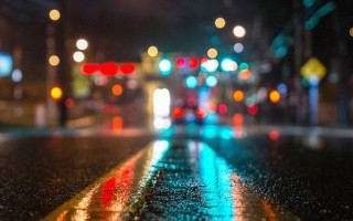 Blurry city street night traffic - a wet surface free wallpaper