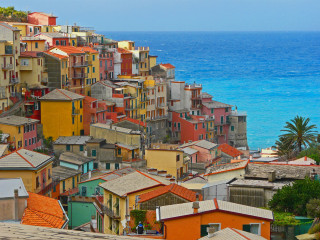 Colorful hillside ocean buildings people - the roof free wallpaper