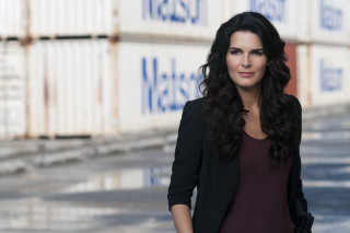 Woman standing shipping containers hands - serial free wallpaper