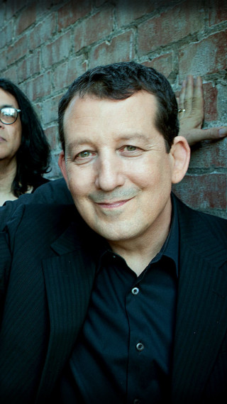 Man woman brick wall standing - a man and woman free wallpaper for mobile