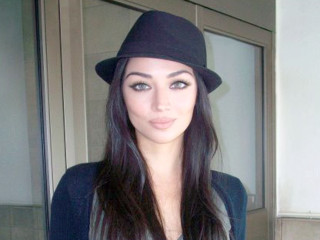 Woman hat jacket bathroom pose - symmetrical feature free wallpaper