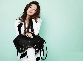 Woman sitting chair holding purse - a chair holding free wallpaper