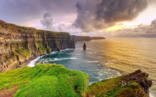 Cliff ocean green grass cloudy - a green grass free wallpaper