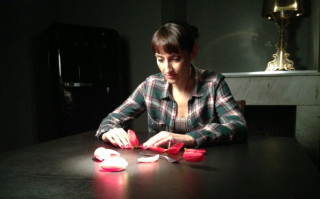 Woman sitting table cutting paper - cutting free wallpaper