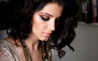 Woman necklace cell phone book - her hand and a book in her other hand free wallpaper