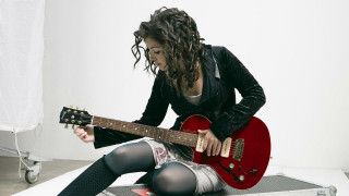 Woman sitting floor red guitar - a floor free wallpaper