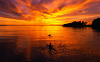 Person riding surfboard water sunset - cloud above free wallpaper