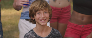 Young boy smiling toothbrush mouth - a tilt shift photo free wallpaper