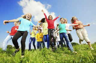 Young people jumping field grass - young person free wallpaper