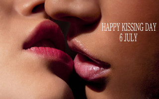 Woman kissing man happy kissing - a message below free wallpaper