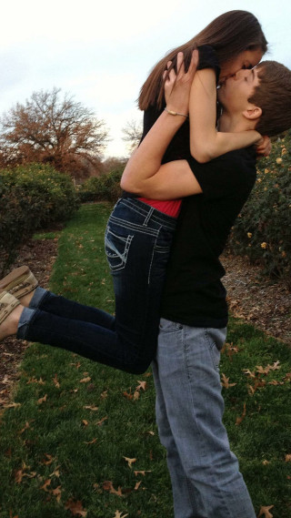 Man woman hugging field grass - free valentines wallpaper for mobile