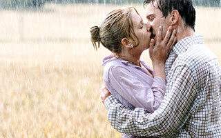 Man woman kissing rain field 2 - free valentines wallpaper