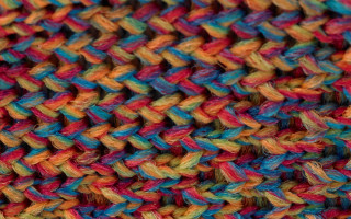 Multicolored knitted blanket black background - anni alber free wallpaper