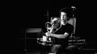 Man sitting chair holding trumpet - fluxus free wallpaper