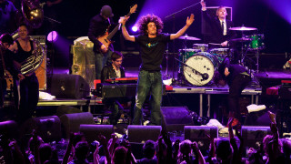 Man standing stage arms raised - david boyd free wallpaper