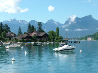 Boat water mountain houses pier - the water near a mountain range free wallpaper