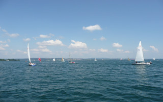 Sailboats sailing large body water - panoramic view free wallpaper