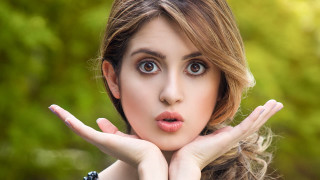 Woman hands face surprised expression - big eye free wallpaper