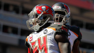 Football players helmets field clock - two football player free wallpaper