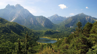 Lake surrounded by mountains trees 3 - the middle of a forest area free wallpaper