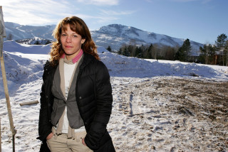 Woman snow ski pole mountain - her hand and a mountain in the background free wallpaper