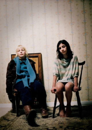 Woman boy chair room wallpapered - a still life free wallpaper for mobile