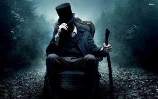 Man top hat coat sitting - a man in a top hat free wallpaper