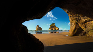 Beach cave view blue sky - a view of a beach free wallpaper