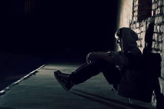 Person sitting ledgedark backpack cellphone - ben thompson free wallpaper