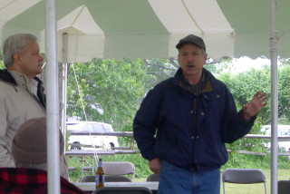 Two men talking under tent - mitchell mohrhauser free wallpaper