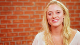 Blonde woman white shirt smiling 2 - bright studio setting free wallpaper