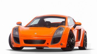 Bright orange sports car front 2 - this image free wallpaper