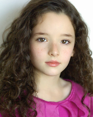 Young girl curly hair pink - a pink shirt free wallpaper for mobile