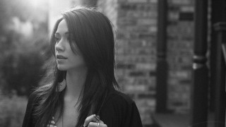 Woman brick building phone ear - christabel dennison free wallpaper