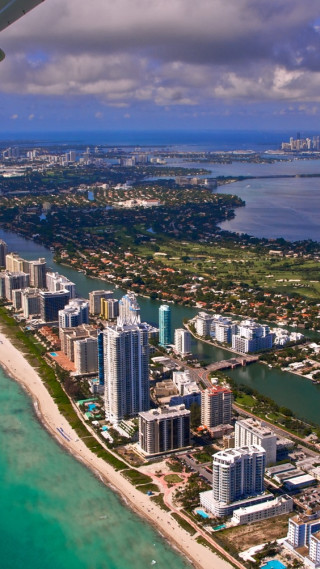 City view airplane ocean beach - an airplane window free wallpaper for mobile