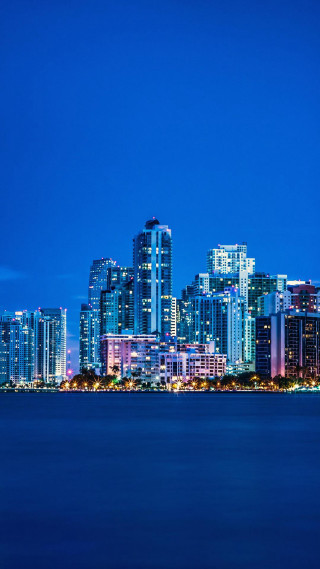 City skyline night water boat 4 - free city wallpaper for mobile