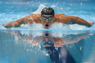 Man swimming pool goggles face - his hands out free wallpaper