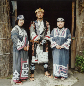 Three people native clothing hut - open free wallpaper for tablet