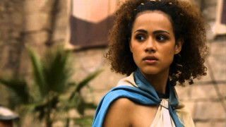 Woman blue scarf brick building - a palm tree in the foreground free wallpaper