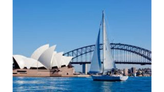 Sailboat sailing bridge building background - a large building in the background free wallpaper